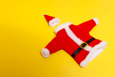 Santa suit with hat, on a yellow backgroundの写真素材