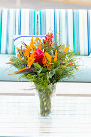 Flowers arrangement on table outdoors on the terrace of the houseの写真素材