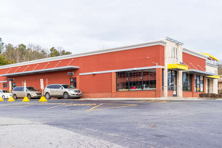 Buford, Georgia - Jan 17th 2021: Vehicles queue to buy food by drive thru at McDonalds in Buford, USAのeditorial素材