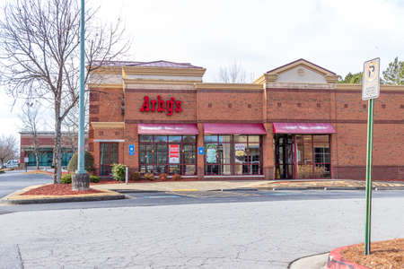 Buford, Georgia - Jan 17th 2021: Main facade of Arby's restaurant in Buford, Georgiaのeditorial素材