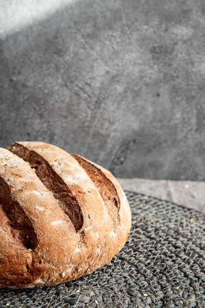 Bread in basket on gray marbled backgroundの写真素材
