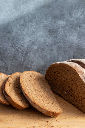Bread in basket on gray marbled background