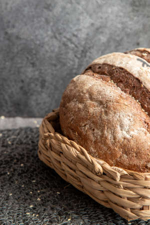 Bread in basket on gray marbled backgroundの写真素材