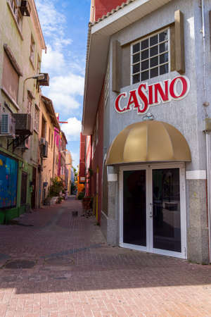 View of people in the colorful alleys of Willemstad in Curacaoのeditorial素材