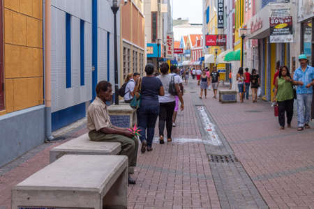 Willemstad, Curacao - Nov 06th 2014: View of people in the colorful alleys of Willemstad in Curacaoのeditorial素材