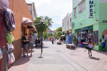 Willemstad, Curacao - Nov 06th 2014: View of people in the colorful alleys of Willemstad in Curacao
