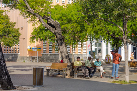 Seniors chatting in a square in Willemstad, Curacaoのeditorial素材