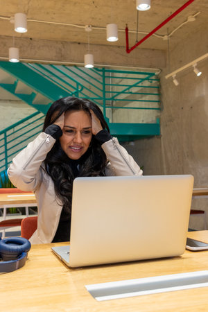 Brunette business woman working from her workspaceの写真素材