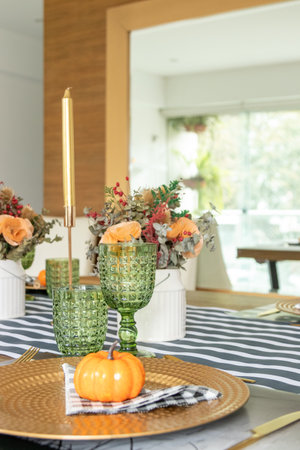 Table decorated for food on the occasion of Halloween, with flowers.の写真素材