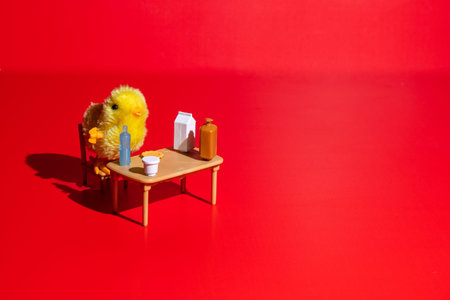 Cute baby chick sitting on a table, ready to eat. Conceptual.の写真素材