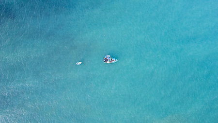 Two fishing boat on the turquoise seaの写真素材
