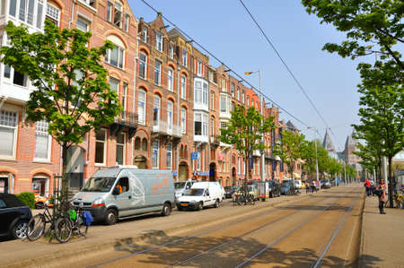 Beautiful street with cars and bikes in Amsterdam, Holland (Netherlands)のeditorial素材
