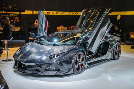 FRANKFURT - SEPT 21: Lamborghini Aventador Carbonado by Mansory presented as world premiere at the 65th IAA (Internationale Automobil Ausstellung) on September 21, 2013 in Frankfurt, Germanyのeditorial素材