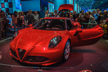 FRANKFURT - SEPT 21: ALFA ROMEO 4C presented as world premiere at the 65th IAA (Internationale Automobil Ausstellung) on September 21, 2013 in Frankfurt, Germanyのeditorial素材