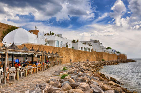 HAMMAMET, TUNISIA - OCT 2014: Cafe on stony beach of ancient Medina on October 6, 2014 in Hammamet,...
