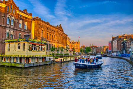 AMSTERDAM, HOLLAND - JUN 2013: Boats on Amstel river on June 5, 2013 in Amsterdam, Netherlandsのeditorial素材
