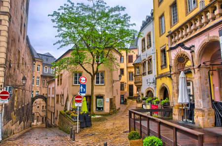 LUXEMBOURG CITY, LUXEMBOURG - JUN 2013: Narrow medieval street with cafes on June 9, 2013 in Luxembourg city, Luxembourgのeditorial素材