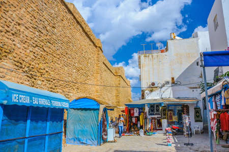 HAMMAMET, TUNISIA - Oct 2014: Stone ancient wall of Medina with bazaar on October 6, 2014 in Hammamet, Tunisiaのeditorial素材