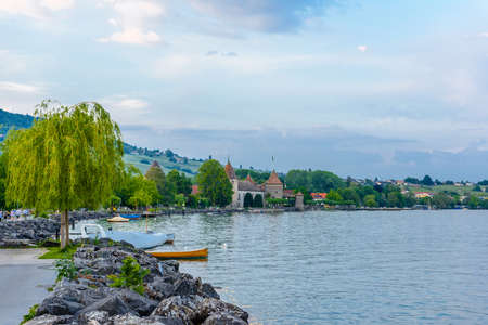 Sunset with reflections on beautiful Geneva lake in Switzerland.の写真素材