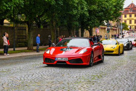 GERMANY, FULDA - JUL 2019: red FERRARI F430 Type F131 cabrio is a sports car produced by the Italian automobile manufacturer Ferrari from 2004 to 2009 as a successor to the Ferrari 360. The car is an update to the 360 with notable exterior and performanceのeditorial素材