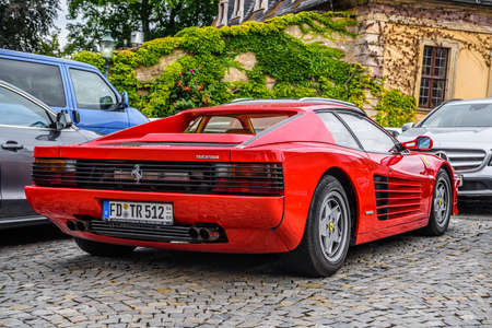 GERMANY, FULDA - JUL 2019: red FERRARI TESTAROSSA Type F110 coupe is a 12-cylinder mid-engine sports car manufactured by Ferrari, which went into production in 1984 as the successor to the Ferrari Berlinetta Boxer. The Pininfarina-designed car was originaのeditorial素材