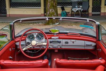 BADEN BADEN, GERMANY - JULY 2019: red leather interior of MERCEDES-BENZ 190 SL roadster cabrio 1955...