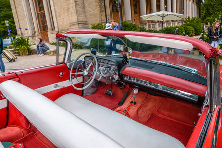 BADEN BADEN, GERMANY - JULY 2019: red white leather interior of BUICK INVICTA first generation convertible 1959 1960 cabrio roadster, oldtimer meeting in Kurpark.のeditorial素材