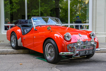 BADEN BADEN, GERMANY - JULY 2019: red TRIUMPH SPORT TR3A TR3 HT cabrio roadster, oldtimer meeting in Kurpark.のeditorial素材
