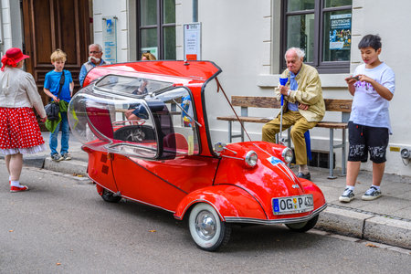 BADEN BADEN, GERMANY - JULY 2019: red MESSERSCHMITT KR200 Cabin Scooter opened 1955 1964, oldtimer meeting in Kurpark.のeditorial素材