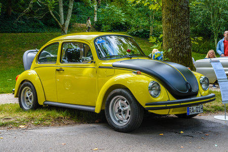 BADEN BADEN, GERMANY - JULY 2019: yellow black VW VOLKSWAGEN BEETLE TYPE 1, oldtimer meeting in Kurpark.のeditorial素材