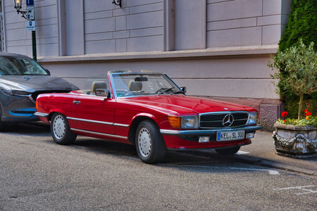 BADEN BADEN, GERMANY - JULY 2022: red mercedes benz 350 slc cabrio roadster, oldtimer meeting in...