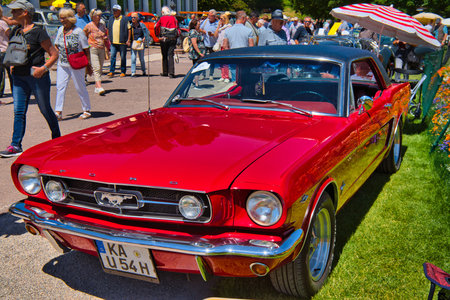 BADEN BADEN, GERMANY - JULY 2022: red FORD MUSTANG coupe first generation 1964 1973, oldtimer...