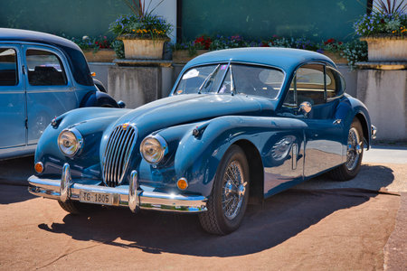 BADEN BADEN, GERMANY - JULY 2022: blue 1955 Jaguar XK140 Fixed Head Coupe, oldtimer meeting in Kurpark.のeditorial素材