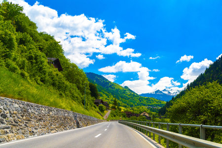Road among Alps mountains, Klosters-Serneus, Davos, Graubuenden Switzerland.の写真素材