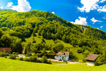 Houses and mountains near Lake Lungern, Lungerersee, Obwalden Switzerland.の写真素材