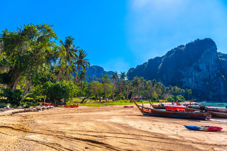 KRABI, THAILAND- MARCH 2018: Long tail boats on tropical beach with palms, Tonsai Bay, Railay Beach, Ao Nang, Krabi, Thailandのeditorial素材