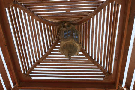 old lightning under the wooden roofの写真素材