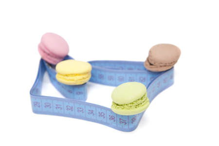 Colorful macaroons and blue meter tapeの写真素材