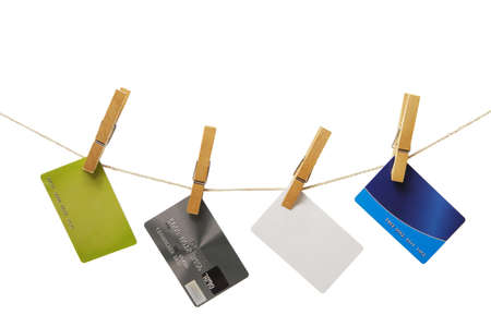 isolated empty credit cards hanging on a rope with space for your textの写真素材