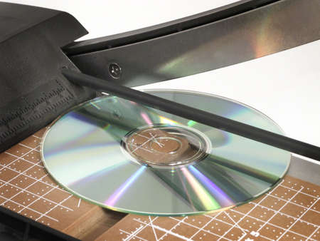 CD on cutting edge of chopper gives new meaning to cutting a CD.