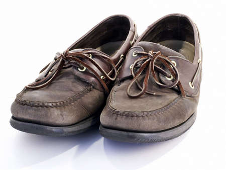 Pair of old worn brown leather boat shoes.の写真素材
