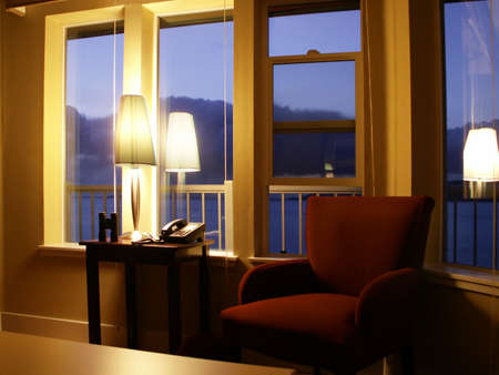 Soft dusk light shows purple hills out windows of boutique hotel.の写真素材