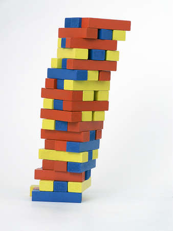 Tower of blocks leans perilously to the right.の写真素材