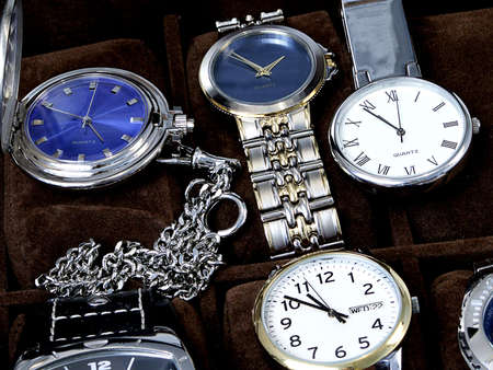Close-up of mens' watches including pocket watches and wrist watches.の写真素材
