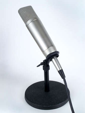 Professional studio "cardioid" microphone on table stand, isolated against white backround.の写真素材