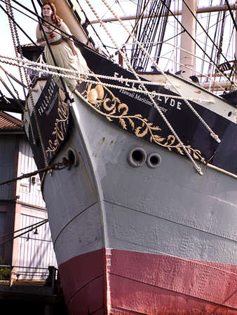 Detail of prow of sailing ship with carved figure of woman.の写真素材