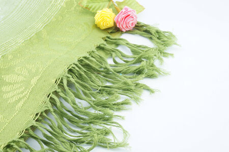 Large green scarf for the neck when cold folding placed on a white background 