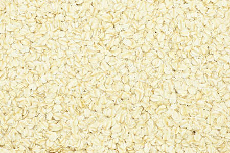 Porridge oats or oatmeal for breakfast put as abstract texture.の写真素材