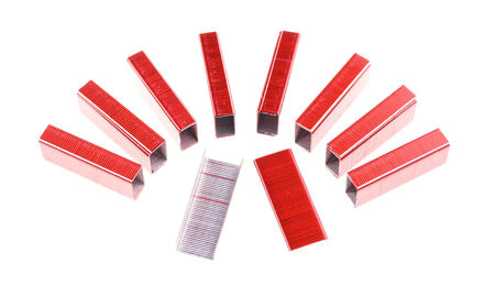 Red and silver staple put as semicircle isolated with white background.の写真素材