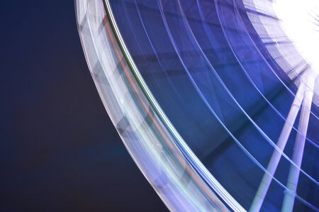 Giant swing is big wheel retro speed light effect on night sky background の写真素材